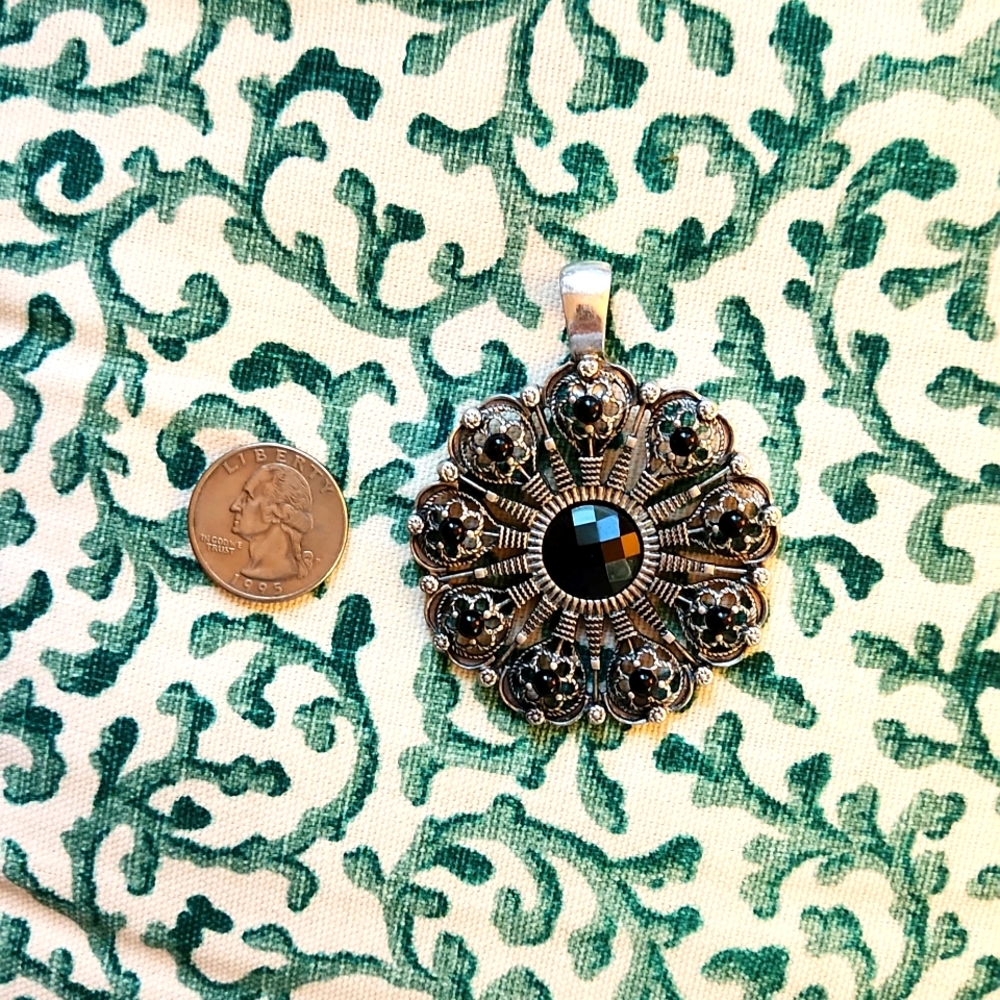 Silver and Black pendant.